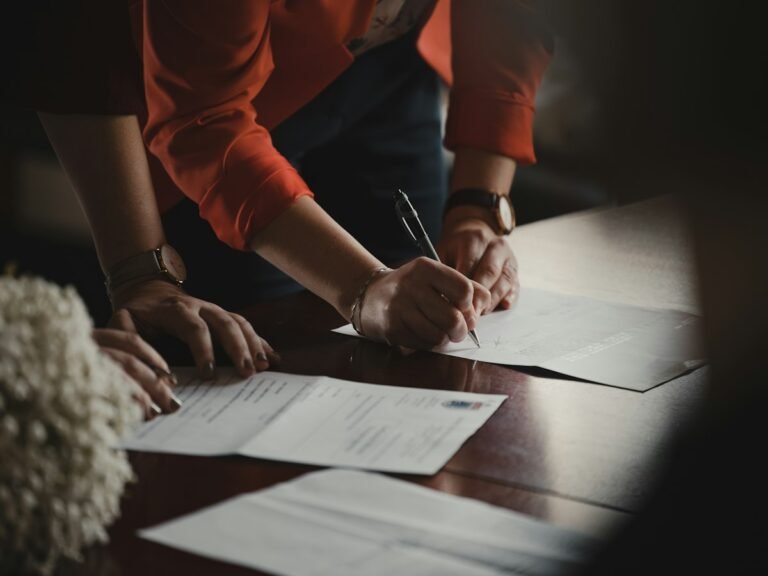 Proposal template: a client and provider reviewing and signing a business proposal